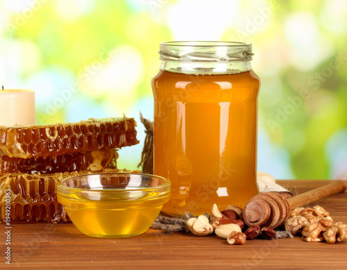Fresh Organic Honey in Glass Jar with Honeycomb, Mixed Nuts, and Wooden Dipper against Blurred Nature Background