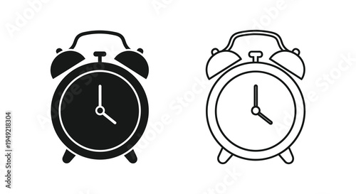 Two alarm clocks one black and one white showcasing a stark silhouette