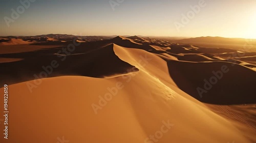Towering Golden Sand Dunes Stretch Towards Distant Horizon At Sunset
