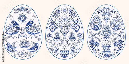 Three ornate blue and white easter eggs with floral and bird designs