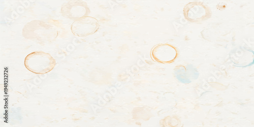 Vintage wedding rings rest on a textured antique parchment backdrop featuring an aged grunge pattern and a brown stone surface design