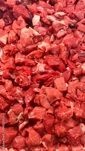 Close-up of fresh raw veal cubes for cooking, meat texture background ideal for culinary and butcher concepts.