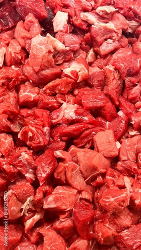 Close-up of fresh raw veal cubes for cooking, meat texture background ideal for culinary and butcher concepts.