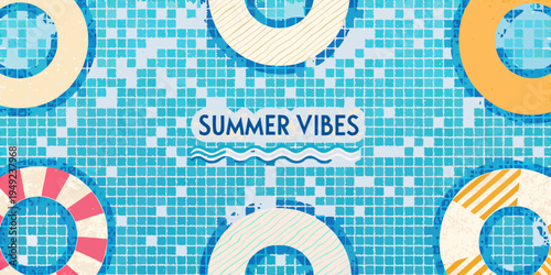 Aerial view of a swimming pool with colorful inflatable rings