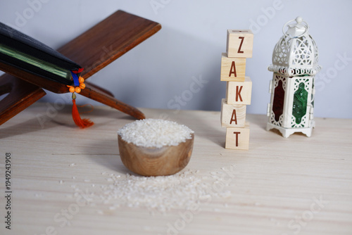 Bild auf Leinwand Zakat background concept: Rice on a wooden bowl, prayer beads, dhikr, lanterns