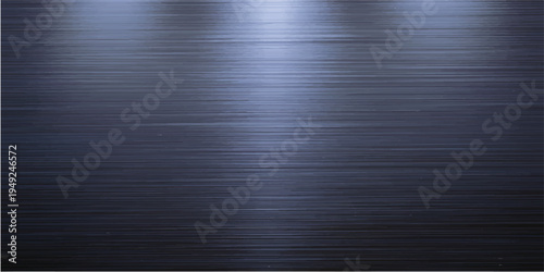 A polished silver stainless steel plate with a brushed metal texture creates a sleek industrial backdrop featuring a shiny metallic pattern and dark grey light reflections on its aluminum surface