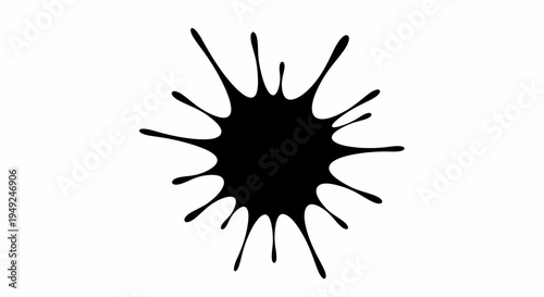 A single black ink blot on a clean surface. The ink blot's shape is irregular with spiky edges, showcasing a dynamic, spreading effect