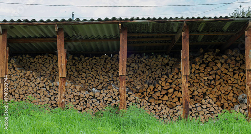 Wallpaper Mural birch split firewood is stacked under a slate canopy Torontodigital.ca