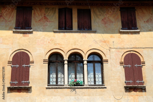 Quadro su tela Traditional European Building Facade with Windows, Portogruaro, Italy