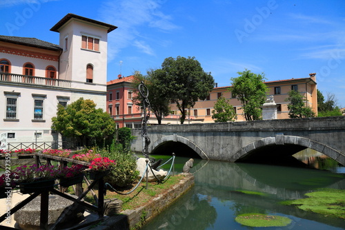 Photos Historic stone bridge over tranquil canal, Portogruaro, Italy