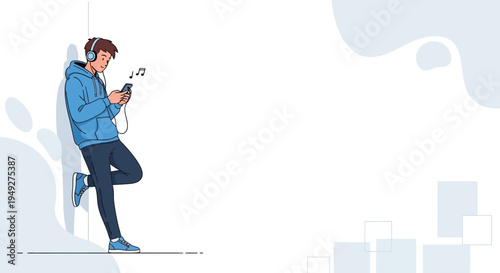 Young man listening to music on headphones with smartphone, leaning against wall