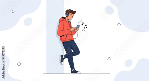 Young man listening to music on headphones with smartphone, leaning against wall
