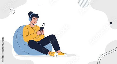 Young man listening to music on smartphone while relaxing on bean bag chair