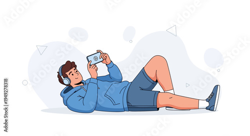 Young man lying down watching video on smartphone with headphones