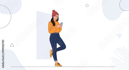 Young Woman in Beanie and Orange Sweater Using Smartphone, Leaning on Wall