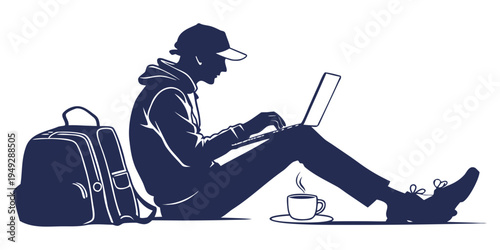 A person sitting on the floor with a laptop and a cup of coffee next to a backpack