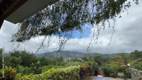 View from villa pool looking toward mountain landscape.