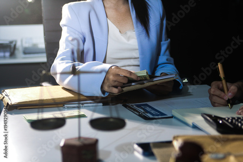 Consultation and conference of professional businesswoman and Male lawyers working and discussion having at law firm in office. Concepts of law, Judge gavel with scales of justice