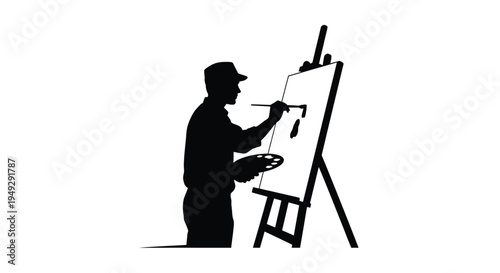 Artist painting at an easel a striking black silhouette