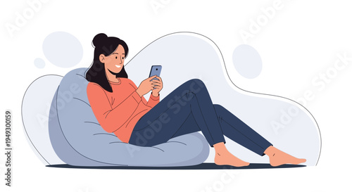 Young woman relaxing on bean bag chair, happily using smartphone, casual lifestyle