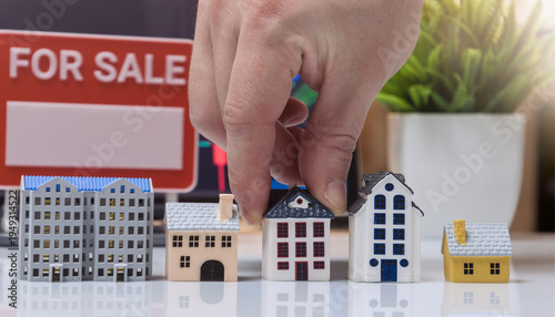 Принти на полотні Hand Placing House Model near For Sale Sign Real Estate Concept