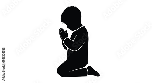 A young boy kneeling in prayer a striking black silhouette