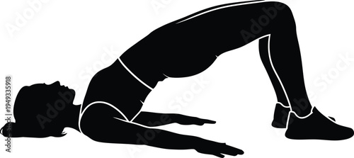 Woman performing a yoga bridge pose