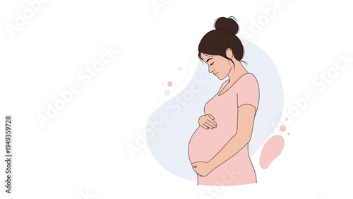 Pregnant woman wearing a pink dress gently holding her belly while standing against a simple blue background.