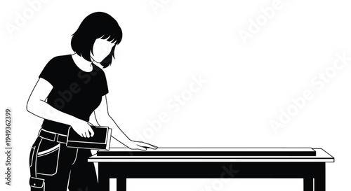 A woman in a t shirt using a tablet at a table