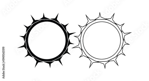 Two circular frames with spiked edges a striking black and white silhouette