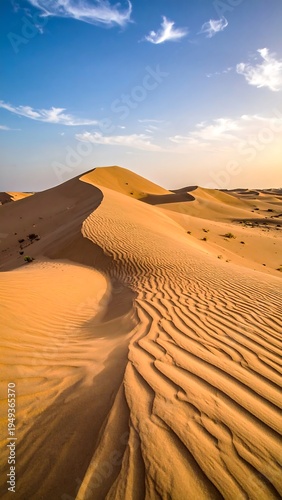 Golden desert dunes at sunset
