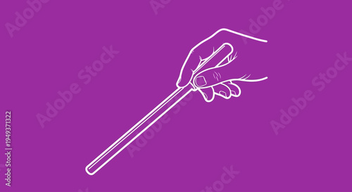 Hand holding a magic wand tightly.