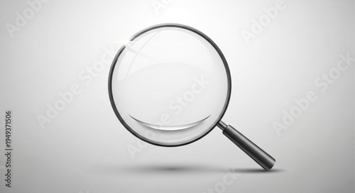 Magnifying glass with a clean reflective surface and black handle.