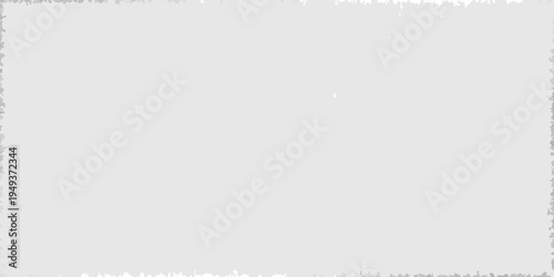 A largely blank light gray image with a subtle textured background