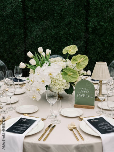 Festive dining setup with flowers and table settings at a special event