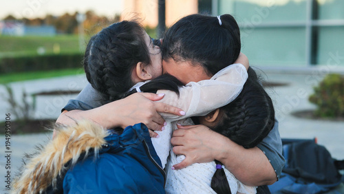 Family reunion, mother embracing children, feeling love and gratitude during homecoming