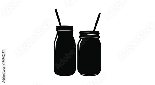 Two mason jar drinks with straws presented as a dark silhouette