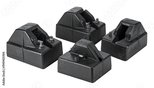 Four black plastic electrical components