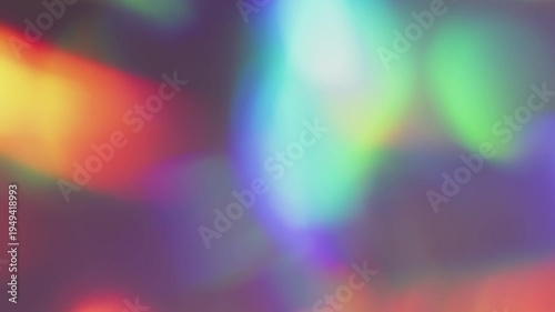 Defocused rainbow light. Gradient reflection. Abstract colorful glow mix on dark background. Red blue green holographic bright neon gleam optic effect .