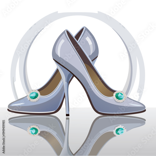 Elegant light blue high heels with emerald embellishments and reflection