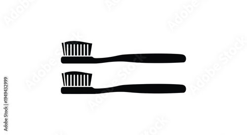 Two black toothbrushes are displayed on a plain white background