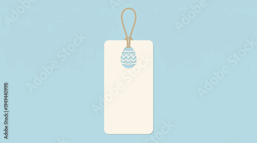 Blank cream vertical rectangular tag with rounded corners and a light blue patterned Easter egg cut-out, suspended by a brown rope loop against a solid light blue background