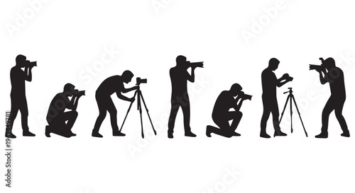 A group of photographers in various poses capturing moments with their cameras and tripods.