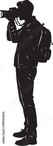 Silhouette of a photographer capturing a moment with a camera and backpack.