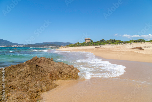 Idyllic sandy beach with turquoise water and rocky coastline near Ajaccio, Corsica, Mediterranean summer landscape