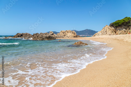 Idyllic sandy beach with turquoise water and rocky coastline near Ajaccio, Corsica, Mediterranean summer landscape