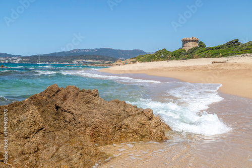 Idyllic sandy beach with turquoise water and rocky coastline near Ajaccio, Corsica, Mediterranean summer landscape