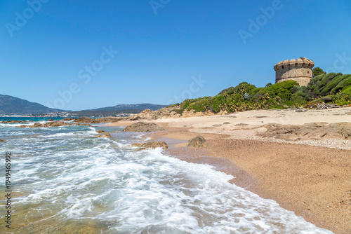 Idyllic sandy beach with turquoise water and rocky coastline near Ajaccio, Corsica, Mediterranean summer landscape