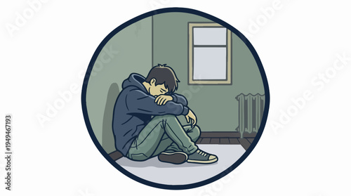 Depressed young man sitting alone on the floor.