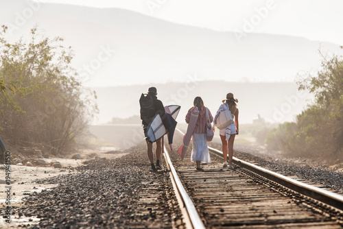 Group walking along the rail road tracks